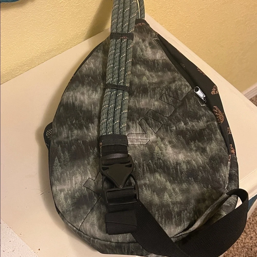 Kavu Pinecone Print Sling Backpack in Black and Brown
